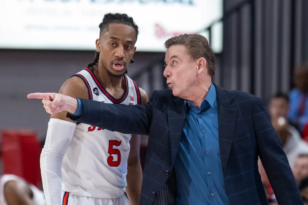 Daniss Jenkins with hall of fame head coach Rick Pitino at St. John's