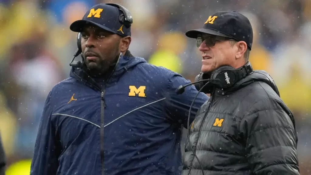 Michigan HC Sherrone Moore and former HC Jim Harbaugh.